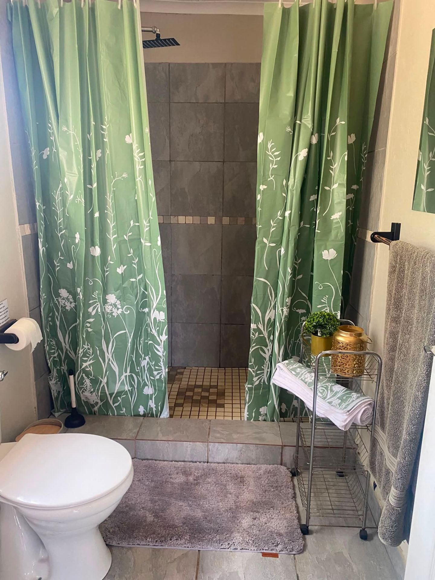 En-suite bathroom with elegant finishes in the Wild Olive Suite