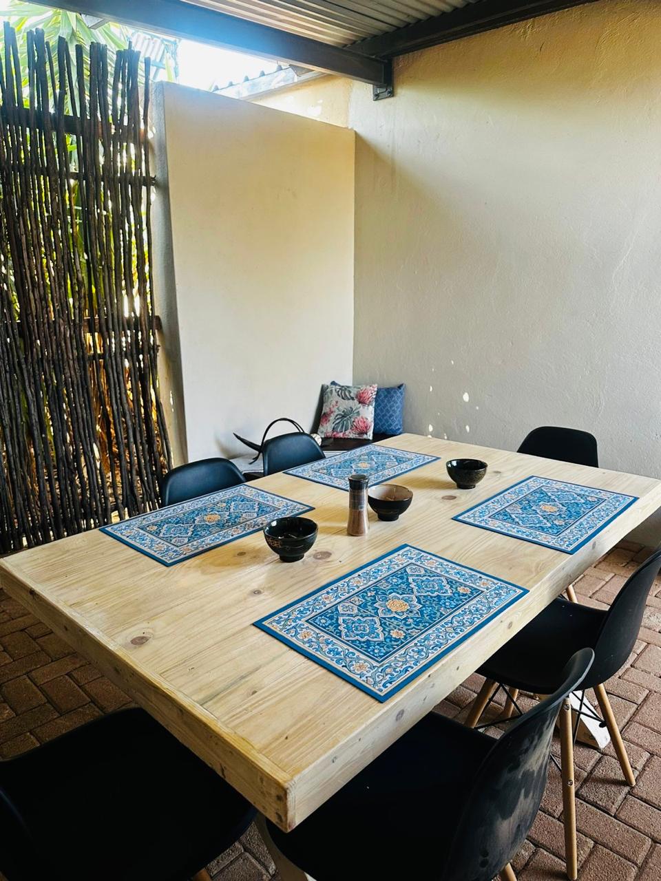 Private stoep and patio seating overlooking the bushveld at the Wild Olive Suite